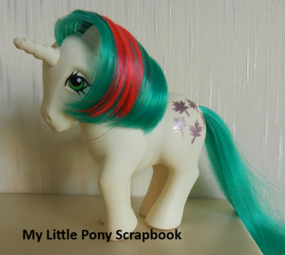 White
          unicorn with green and red hair and maple leaves